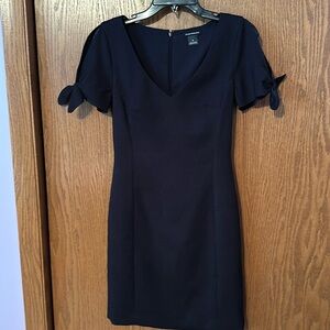 Club Monaco size 0 black dress with open ties on each side.